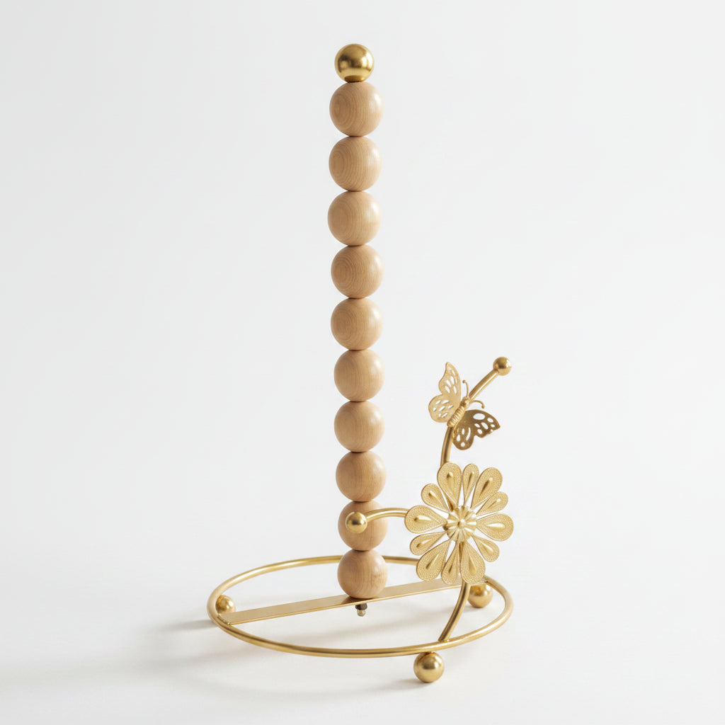 Luxury gold kitchen tissue paper holder stand on a marble countertop with a paper roll installed