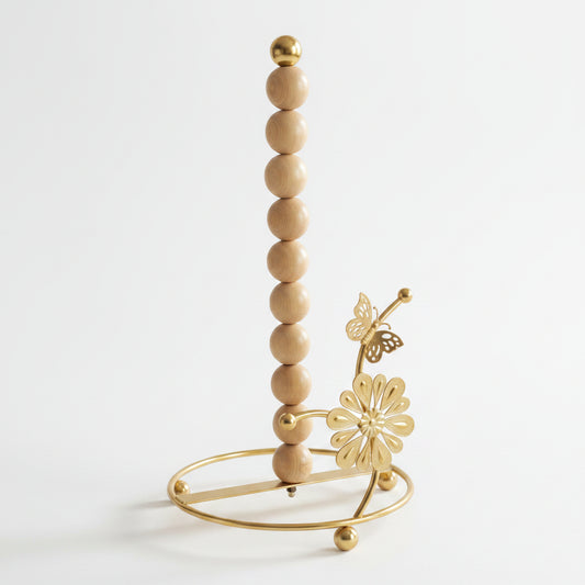 Luxury gold kitchen tissue paper holder stand on a marble countertop with a paper roll installed
