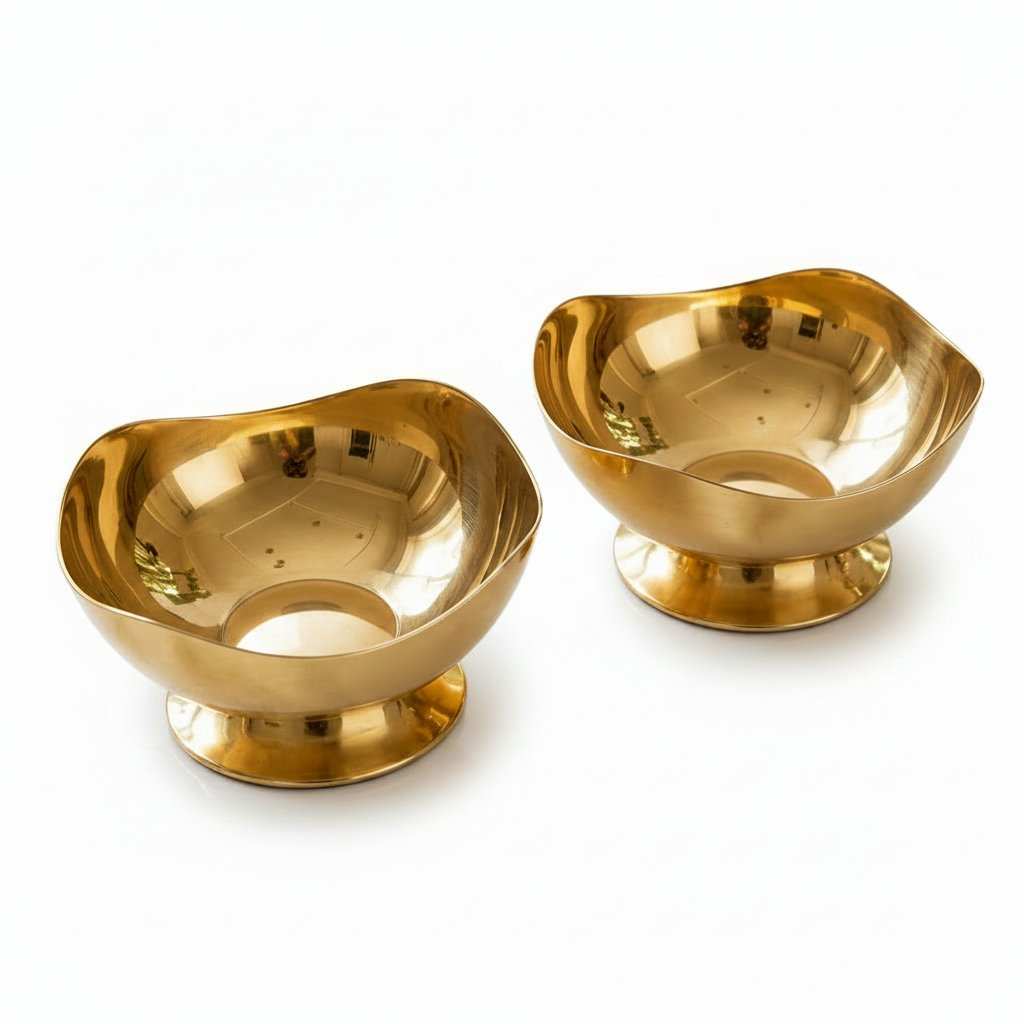 Luxury gold stainless steel ice cream bowl filled with dessert scoops and a golden spoon on a table