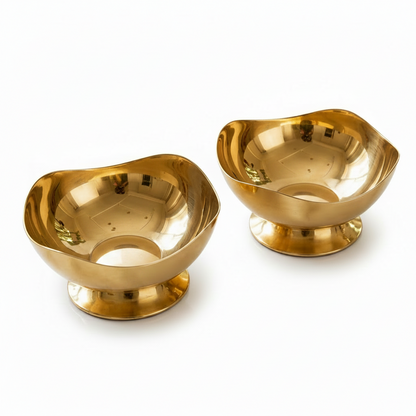 Luxury gold stainless steel ice cream bowl filled with dessert scoops and a golden spoon on a table
