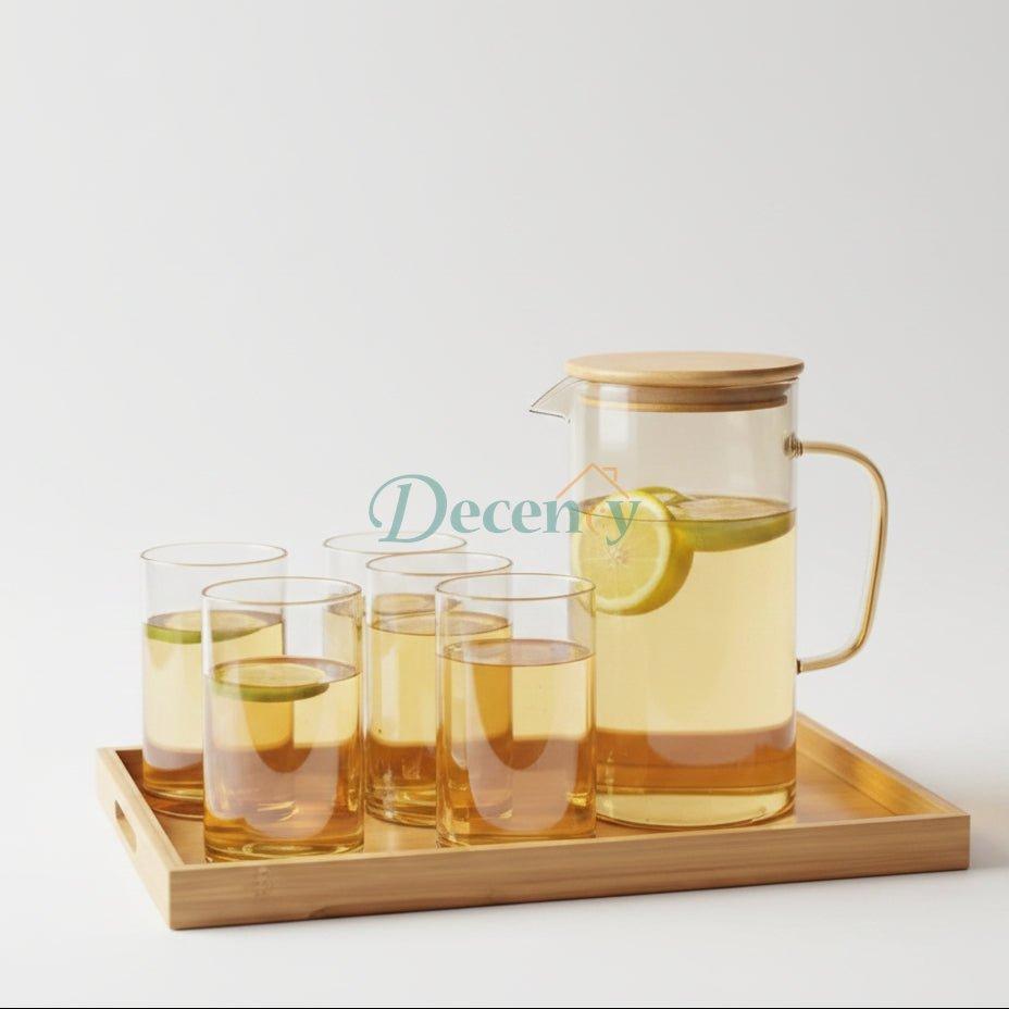 golden glass water pitcher set with bamboo lid and 6 matching cups.