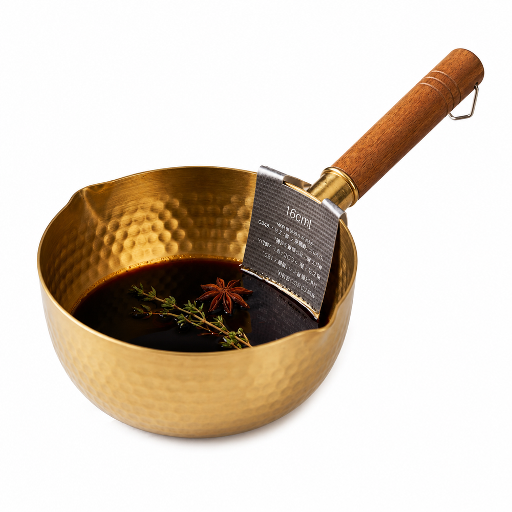 16cm hammered brass saucepan with a ergonomic wooden handle on a white background