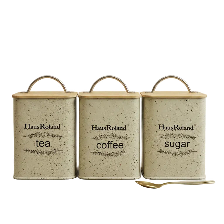 Haus Roland set of 3 grey speckled tea coffee sugar canisters with bamboo lids on a marble countertop