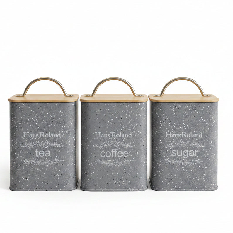 Haus Roland set of 3 grey speckled tea coffee sugar canisters with bamboo lids on a marble countertop