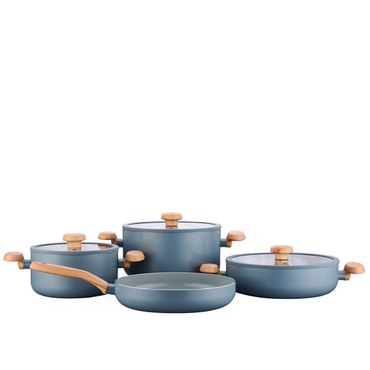 Complete Korkmaz 7-piece ceramic pots and pans set arranged on a kitchen counter.