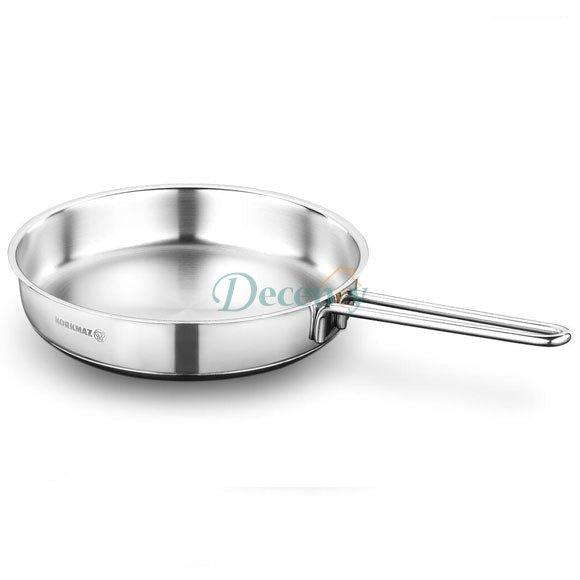 Korkmaz Perla 24cm stainless steel fry pan with ergonomic handle on a kitchen counter in Pakistan.