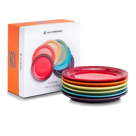 Le Creuset Rainbow Tea Plates set of 6 displaying six different vibrant colors on a white background.