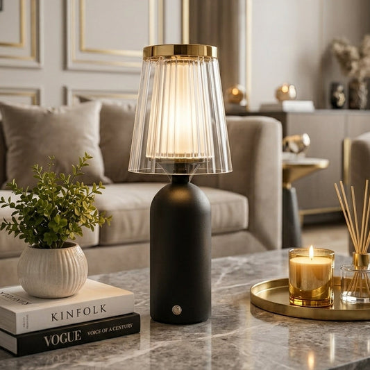 Luxe Prism LED table lamp illuminated on a marble coffee table in a modern living room setting