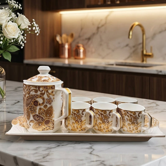8 piece luxury golden ceramic tea set with teapot, 6 cups, and serving tray on a marble countertop
