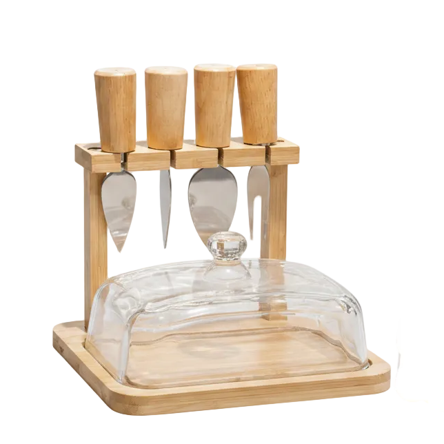 Luxury bamboo butter dish with a clear glass lid placed on a wooden dining table.