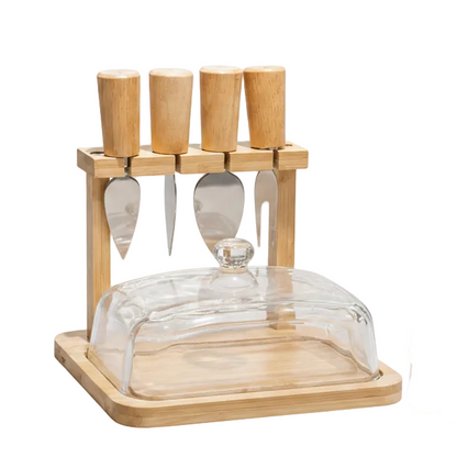 Luxury bamboo butter dish with a clear glass lid placed on a wooden dining table.