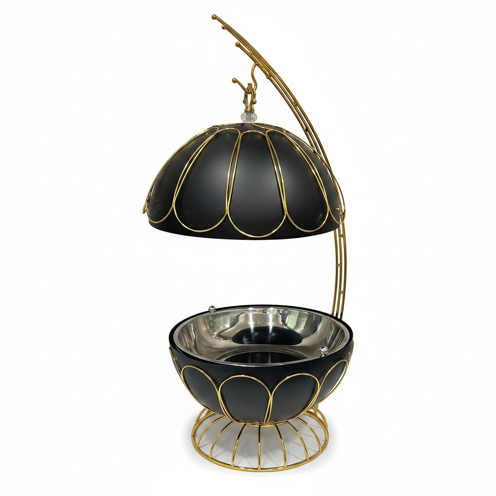 Luxury 8L black and gold crown chafing dish placed on a marble dining counter.