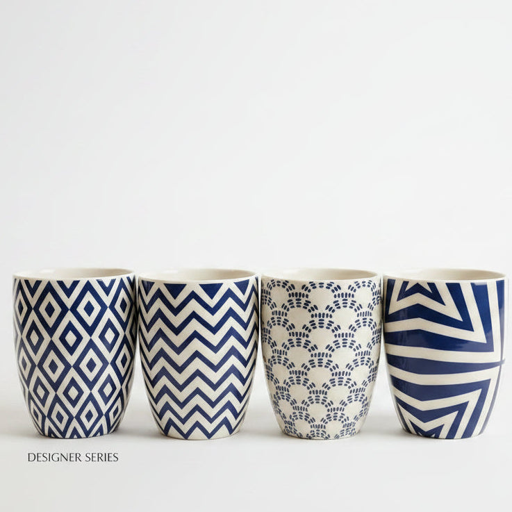 Single luxury blue and white printed ceramic mug displayed on a marble countertop.