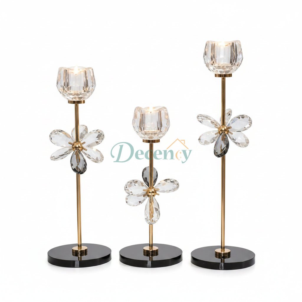 Luxury 3-piece crystal floral candle holder set displayed as a centerpiece on a white marble table.