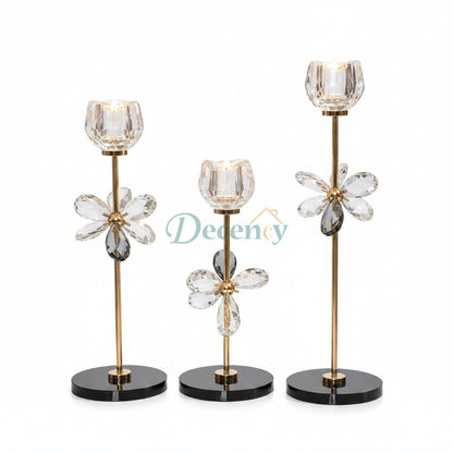 Luxury 3-piece crystal floral candle holder set displayed as a centerpiece on a white marble table.
