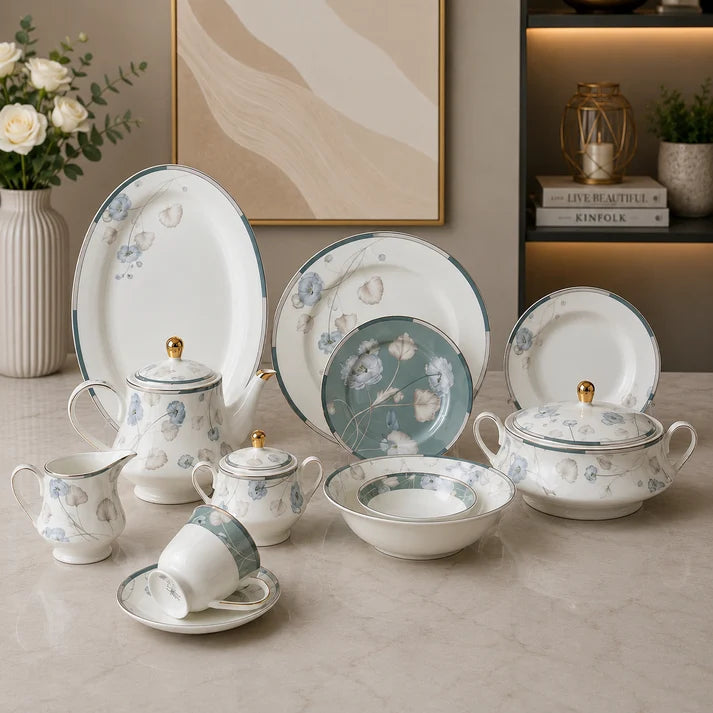 Complete 61-piece floral porcelain dinner set displayed on a marble kitchen island