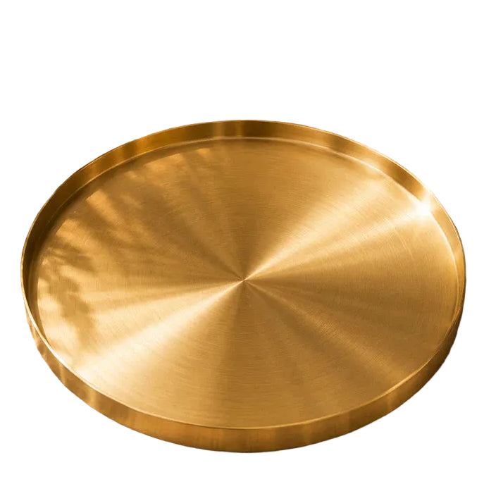 Luxury round serving tray in gold finish 30cm on a modern dining table