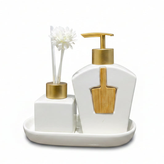 Luxury white ceramic liquid soap dispenser and matching diffuser bottle on a marble vanity tray.