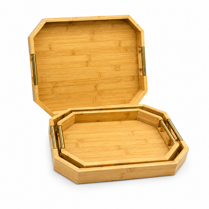Luxury octagonal wooden serving tray set with metallic gold handles stacked on a coffee table