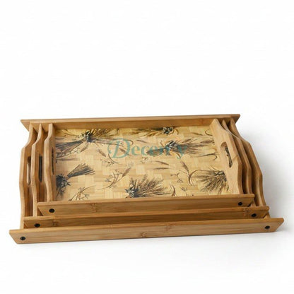 Set of 3 luxury wooden serving trays with decorative floral patterns stacked on a walnut dining table.