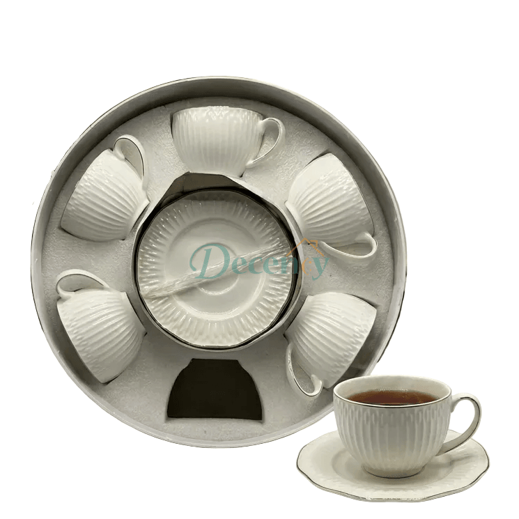 Elegant textured tea cup filled with milk tea resting on its matching saucer.