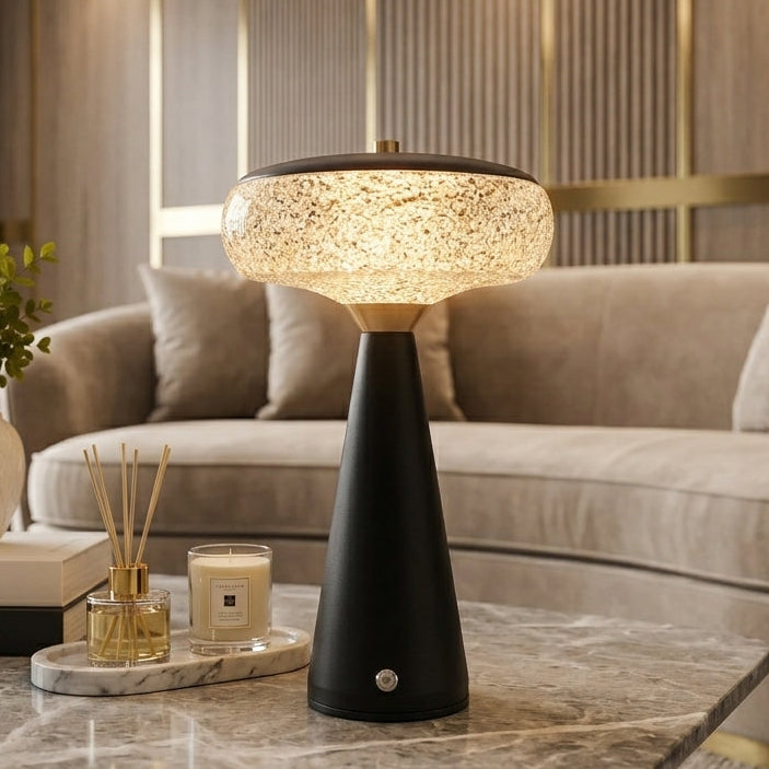 Modern rechargeable LED table lamp placed on a marble coffee table in a luxury living room