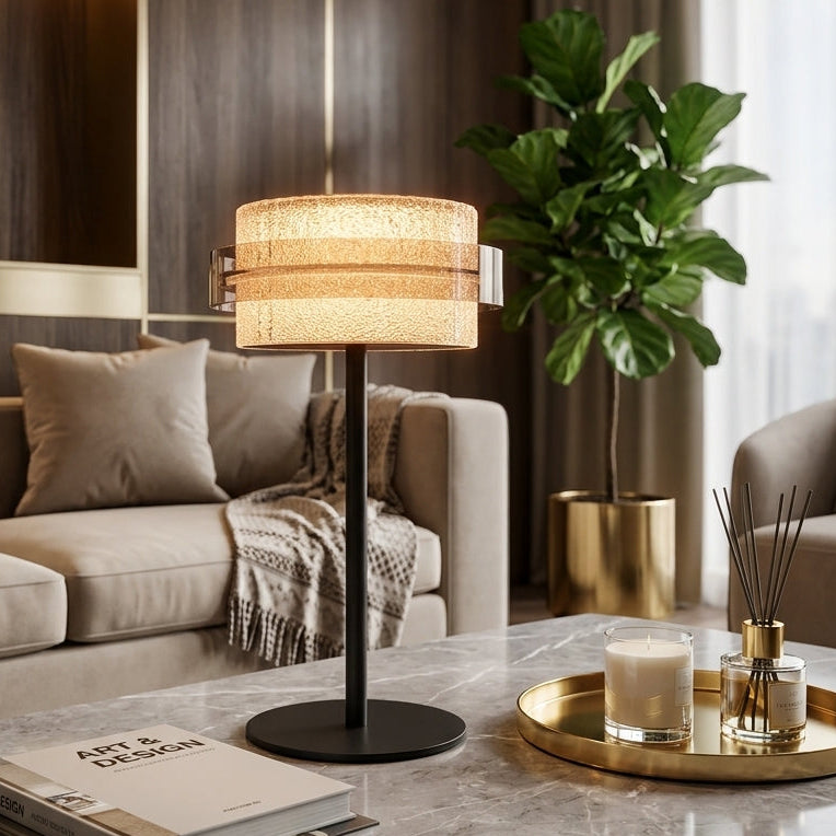 Modern crystal LED table lamp placed on a marble coffee table in a modern living room setting.