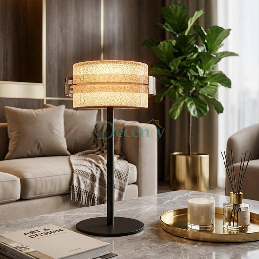 Modern crystal LED table lamp placed on a marble coffee table in a modern living room setting.