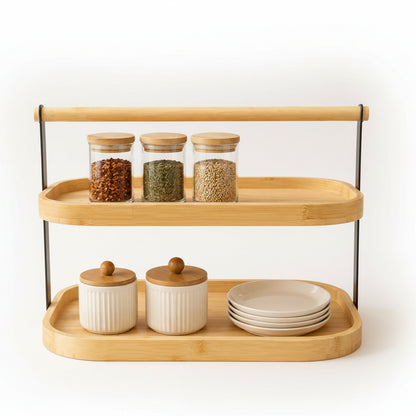 2-tier bamboo kitchen countertop organizer holding spice jars on a modern Pakistani kitchen counter.
