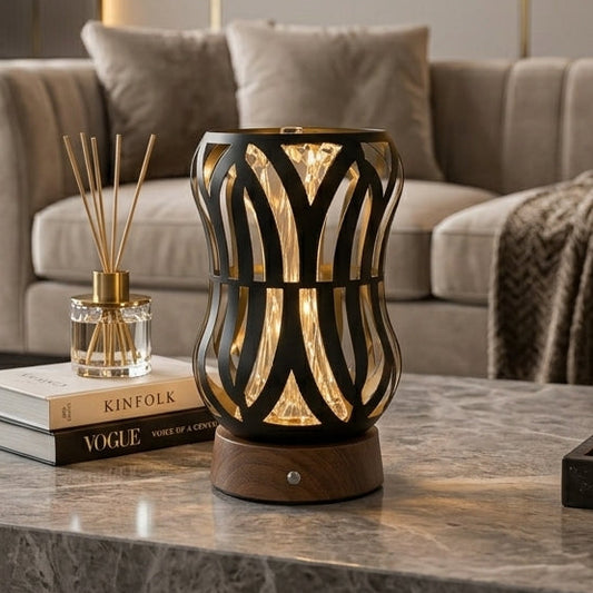 Modern black metal cage table lamp sitting on a marble coffee table in a modern Pakistani living room setup.