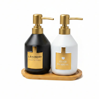 Modern soap dispenser set with dual pumps resting on a wooden base tray
