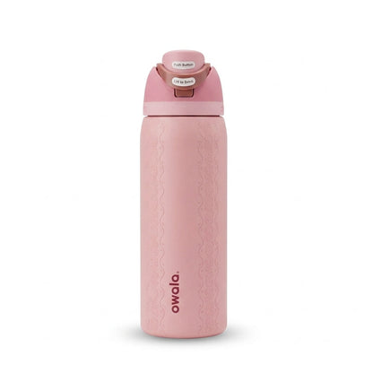 Front view of the Owala FreeSip 32oz Painted Canyon pink insulated water bottle standing upright   