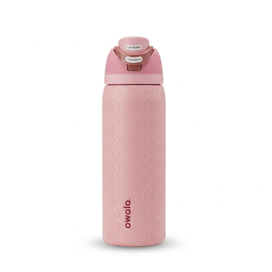Front view of the Owala FreeSip 32oz Painted Canyon pink insulated water bottle standing upright   