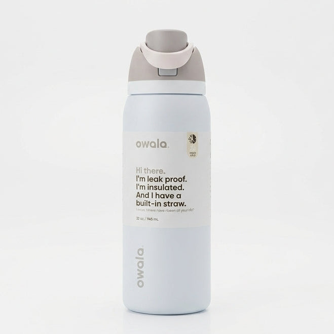 Front view of the Owala FreeSip 32 oz water bottle in Shy Marshmallow color against a clean white background