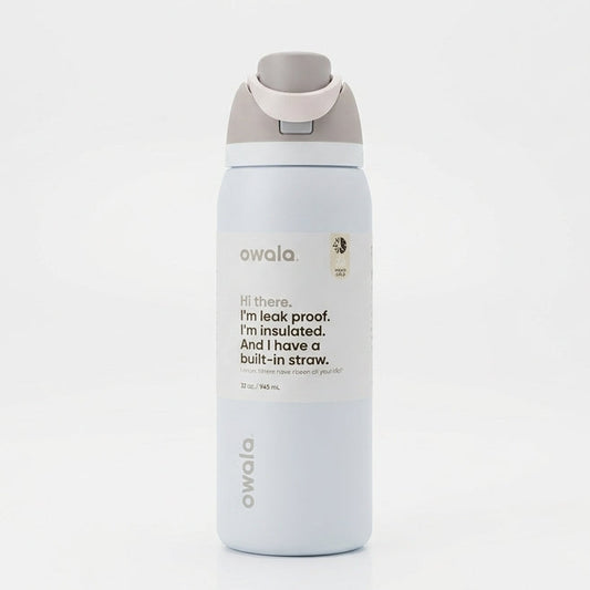 Front view of the Owala FreeSip 32 oz water bottle in Shy Marshmallow color against a clean white background