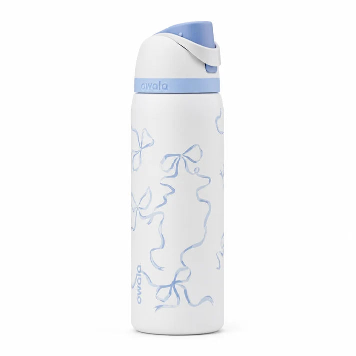 Owala FreeSip Tied & True 32 oz stainless steel insulated water bottle standing on a kitchen counter