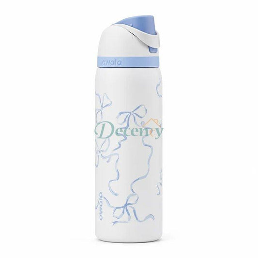 Owala FreeSip Tied & True 32 oz stainless steel insulated water bottle standing on a kitchen counter