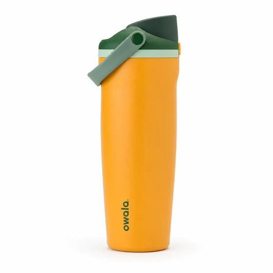 Owala FreeSip stainless steel insulated water bottle in mustard yellow and green placed on a marble kitchen counter