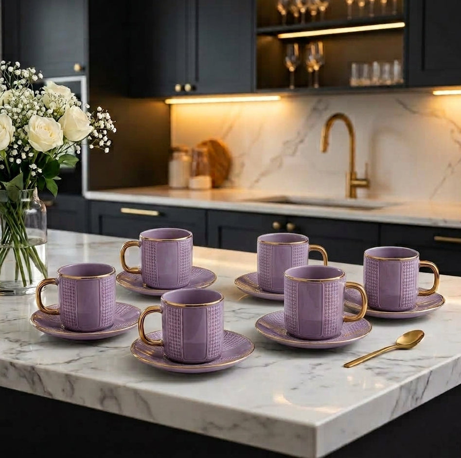 Luxury 6 piece purple ceramic tea cup and saucer set with gold handles on marble countertop