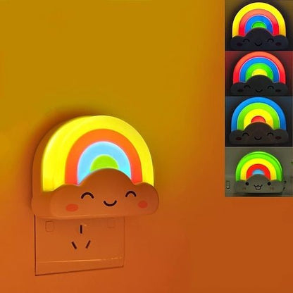 Cute rainbow cloud LED night light plugged into a wall socket glowing softly