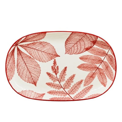 Close up of delicate red leaf texture design on white ceramic platter