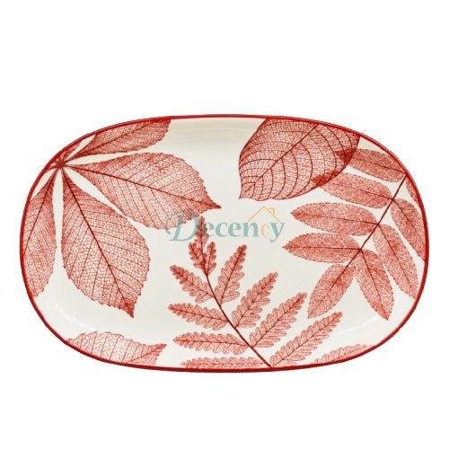 Close up of delicate red leaf texture design on white ceramic platter