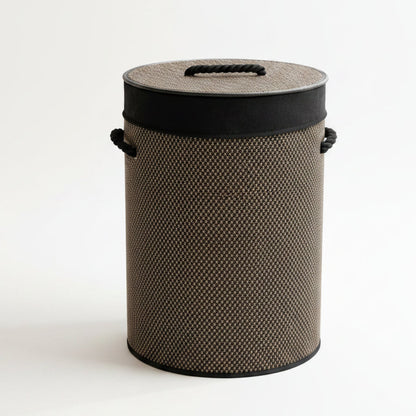 Round natural bamboo laundry basket with matching lid on wooden floor