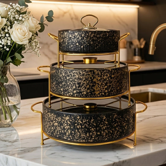 Luxury 3 pcs round black and gold ceramic chafing dish set displayed on marble kitchen counter.