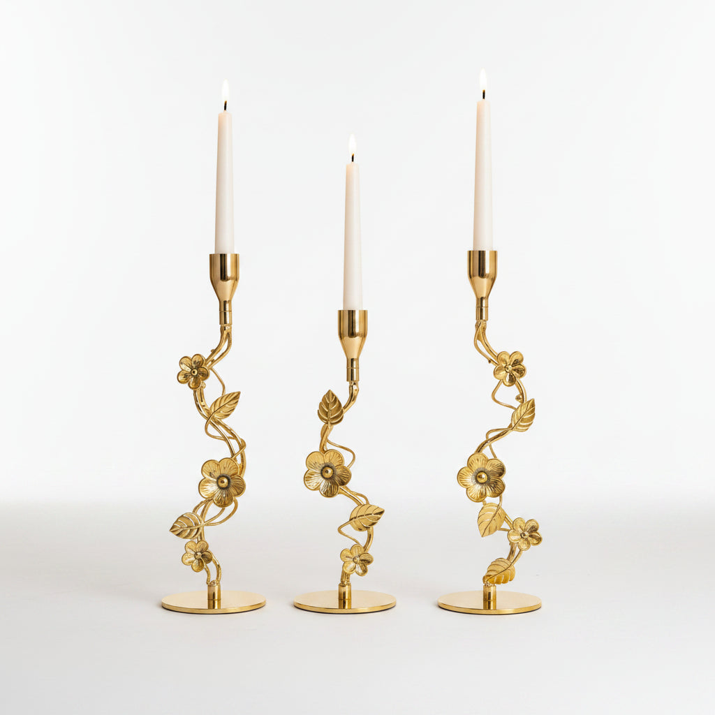 : Royal Golden Vine Candle Holder Set of 3 displayed on a luxury white marble table.