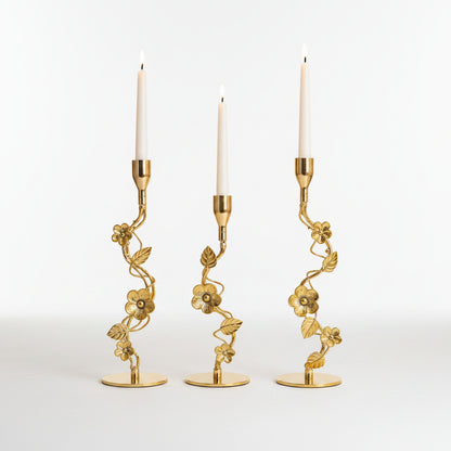 : Royal Golden Vine Candle Holder Set of 3 displayed on a luxury white marble table.