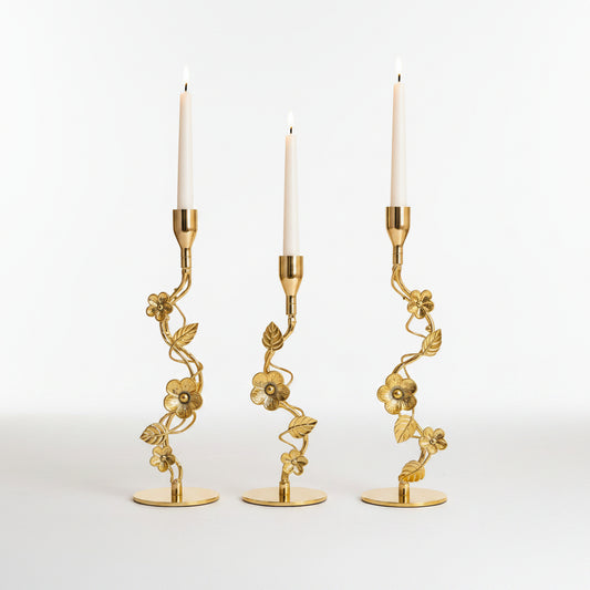 : Royal Golden Vine Candle Holder Set of 3 displayed on a luxury white marble table.