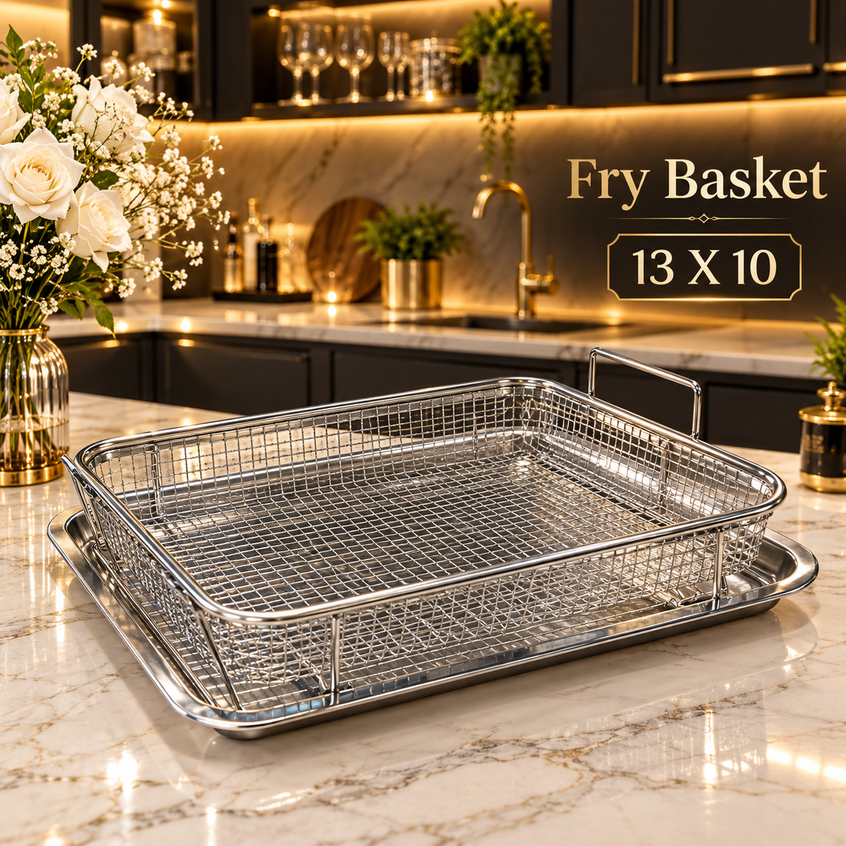 Stainless steel rectangular wire fry basket resting on a matching silver drip tray in a luxury kitchen setup
