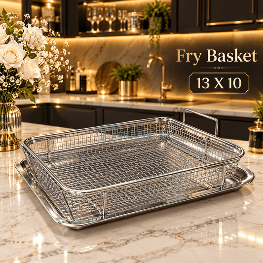 Stainless steel rectangular wire fry basket resting on a matching silver drip tray in a luxury kitchen setup