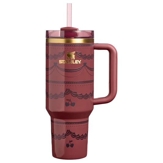 Stanley Quencher H2.0 40oz tumbler in deep Red Velvet Cake shade with gold accent rim.